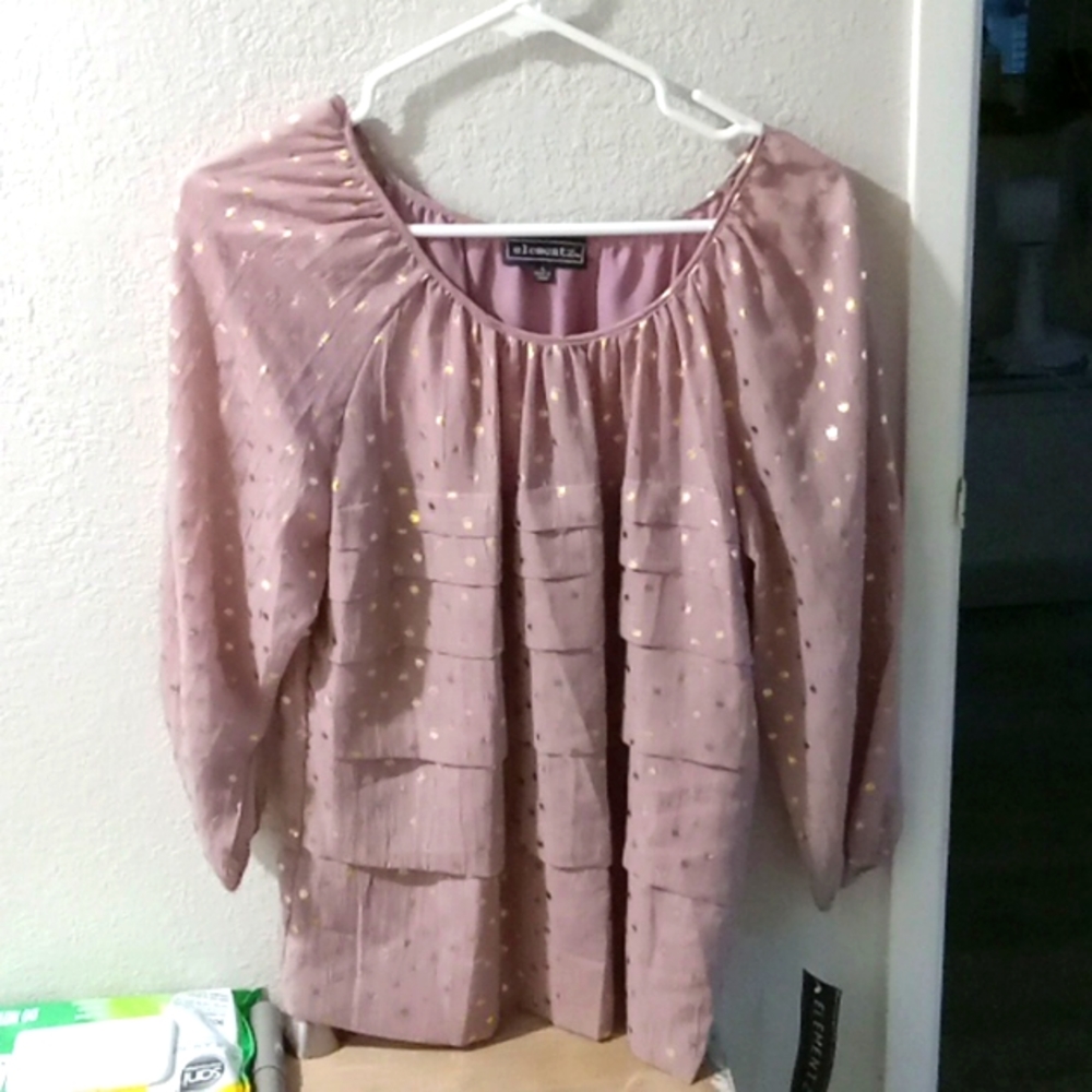 Round neck, 3/4 arm length light plum tierd blouse with gold dots accenting it.